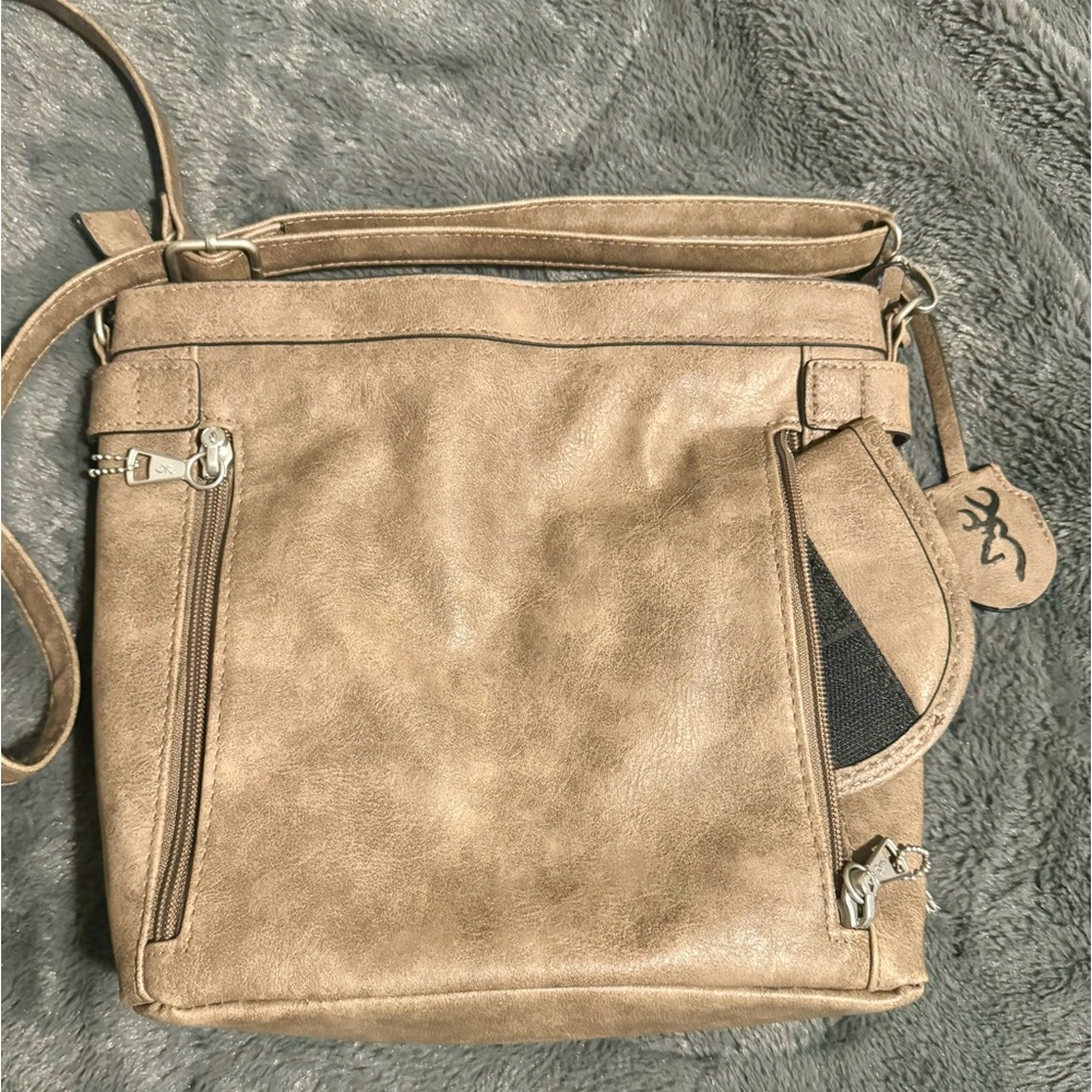 Purse from academy has holster area and zipper with key